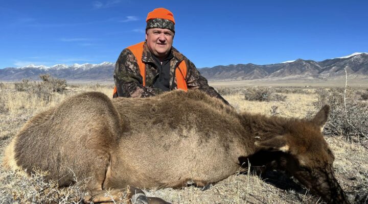 man with dead elk