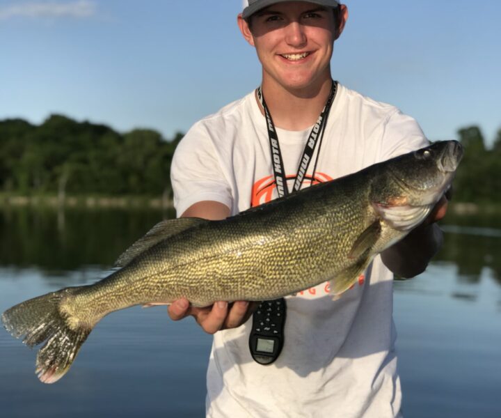 young person holding fish